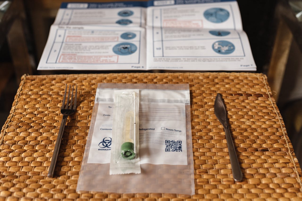 Covid-19 testing kit with instructions on a straw placemat, symbolizing health and safety.